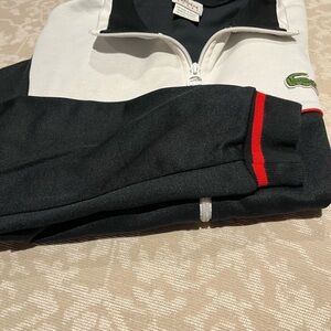 Lacoste zip up varsity jacket.